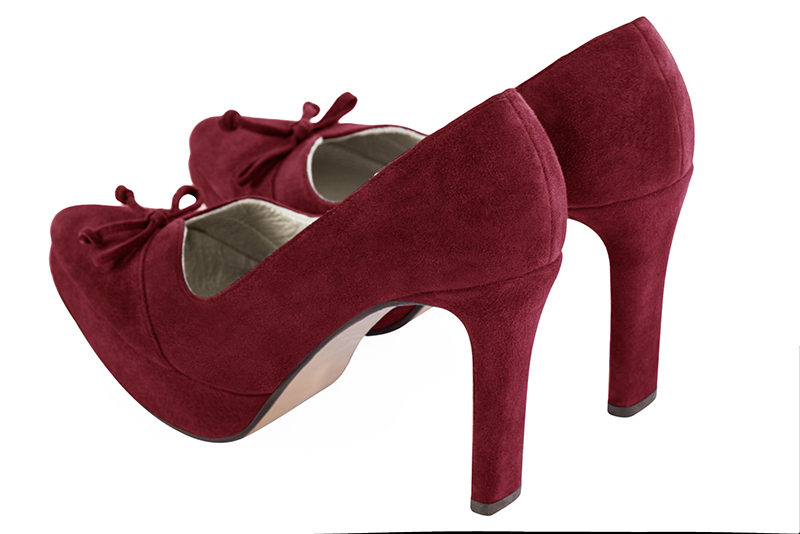 Burgundy red women's dress pumps, with a knot on the front. Tapered toe. Very high slim heel with a platform at the front. Rear view - Florence KOOIJMAN